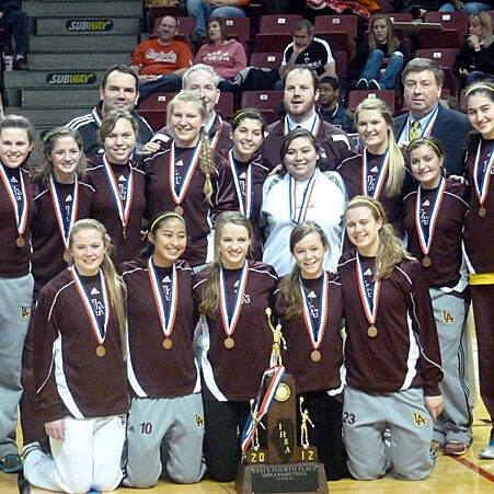 Players, coaches, and managers of Loyola Academy's fourth place state girls basketball team celebrate with their hardware after last Saturday's third place game at Redbird Arena in Normal. In front, kneeling, are the team's five seniors (from left) Mary Kate O'Malley, Michelle Ricolcol, Lauren Kriz, Colleen McShane, and Kathleen Stralka.